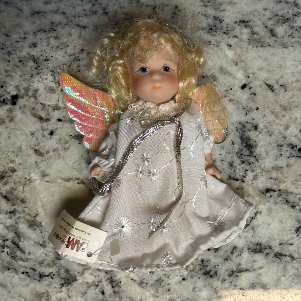 Porcelain Angel Doll with Golden Hair and Iridescent Wings